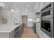 Close-up of a stylish kitchen with quartz counters and stainless steel appliances at 190 Broadleaf Ln, Youngsville, NC 27596