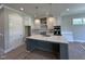 Bright kitchen with a large island, modern appliances, and stylish pendant lighting at 190 Broadleaf Ln, Youngsville, NC 27596