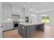 Modern kitchen featuring stainless steel appliances, a large island, and pendant lighting at 190 Broadleaf Ln, Youngsville, NC 27596