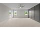 Large main bedroom with natural light, a ceiling fan, and decorative accent wall at 190 Broadleaf Ln, Youngsville, NC 27596