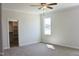 Bright bedroom with carpet, neutral walls, and a window for natural light, and walk-in closet at 24 Surles Landing Way, Benson, NC 27504