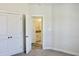 Light-filled bedroom with neutral carpet and access to bathroom at 24 Surles Landing Way, Benson, NC 27504