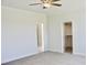 Spacious carpeted bedroom with doorways to a walk-in closet and bathroom at 24 Surles Landing Way, Benson, NC 27504