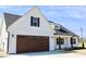 Attractive exterior of new build home with dark roof and green lawn at 24 Surles Landing Way, Benson, NC 27504