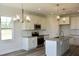 Beautiful kitchen with white cabinets, granite countertops, and stainless steel appliances at 24 Surles Landing Way, Benson, NC 27504