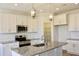 Eat in kitchen with white cabinetry, granite counters and stainless appliances at 24 Surles Landing Way, Benson, NC 27504