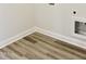 Close-up view of the laundry area with connections and laminate flooring at 24 Surles Landing Way, Benson, NC 27504