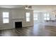 Bright living room featuring a fireplace, lots of natural light, and hardwood floors at 24 Surles Landing Way, Benson, NC 27504
