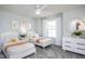 Twin bedroom with two beds, window, and white dresser at 2907 Huxley Way, Apex, NC 27502