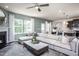 Spacious living room with a large sectional sofa and a fireplace at 2907 Huxley Way, Apex, NC 27502