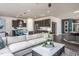 Open concept living room with sectional sofa and view of kitchen at 2907 Huxley Way, Apex, NC 27502