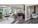 Open living space with L-shaped sectional sofa and game table at 2907 Huxley Way, Apex, NC 27502