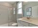Bathroom with shower, single vanity, and white cabinets at 2940 Hanging Valley Way, Wake Forest, NC 27587