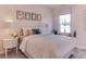 Bedroom with window seat, soft color palette, and decorative pillows at 2940 Hanging Valley Way, Wake Forest, NC 27587