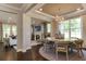 Open concept dining room with a large table and access to the Gathering room at 2940 Hanging Valley Way, Wake Forest, NC 27587
