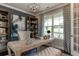 Bright office features built-in shelves and a large window at 2940 Hanging Valley Way, Wake Forest, NC 27587