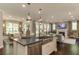 Open concept kitchen with large island, stainless steel appliances, and a view of the Gathering room at 2940 Hanging Valley Way, Wake Forest, NC 27587