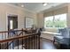 Bright loft area features a built-in window seat, desk, and hardwood floors at 2940 Hanging Valley Way, Wake Forest, NC 27587