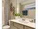 Bathroom with gray vanity, patterned shower curtain, and decorative wall art at 2948 Hanging Valley Way, Wake Forest, NC 27587