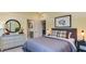 bedroom with gray bedding, dresser, and ensuite bathroom access at 2948 Hanging Valley Way, Wake Forest, NC 27587
