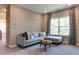 Cozy bonus room with comfortable sectional sofa and plenty of natural light at 2948 Hanging Valley Way, Wake Forest, NC 27587