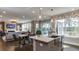 Open kitchen with island and stainless steel appliances, overlooking living room at 2948 Hanging Valley Way, Wake Forest, NC 27587