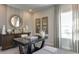 Home office with a large desk, window, and decorative wall art at 2948 Hanging Valley Way, Wake Forest, NC 27587