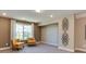 Relaxing sitting area with two mustard armchairs and geometric wall art at 2948 Hanging Valley Way, Wake Forest, NC 27587