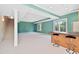 Spacious finished basement with a bar, stairs, carpeted floor, and recessed lighting for entertaining at 306 Neuse Ridge Dr, Clayton, NC 27527