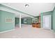 View of the finished basement with a bar, stairs, multiple windows and recessed lighting at 306 Neuse Ridge Dr, Clayton, NC 27527