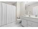 Functional bathroom featuring a toilet, shower with curtain, and single sink vanity at 306 Neuse Ridge Dr, Clayton, NC 27527