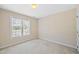 Unfurnished bedroom featuring carpeted floors and a window for a blank canvas at 306 Neuse Ridge Dr, Clayton, NC 27527