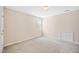 Neutral bedroom featuring carpeted floors, a window, and a closet for comfortable living at 306 Neuse Ridge Dr, Clayton, NC 27527