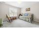 Bedroom with daybed and rocking chair at 306 Neuse Ridge Dr, Clayton, NC 27527