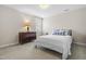 Cozy bedroom with neutral walls and a window, furnished with a bed and dresser at 306 Neuse Ridge Dr, Clayton, NC 27527