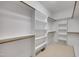 Spacious walk-in closet with ample shelving and hanging space for organized storage at 306 Neuse Ridge Dr, Clayton, NC 27527