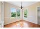Dining room with beautiful hardwood floors and large windows that let in lots of natural light at 306 Neuse Ridge Dr, Clayton, NC 27527