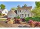 Attractive home with a well-landscaped front yard, showcasing colorful plants and enhancing curb appeal at 306 Neuse Ridge Dr, Clayton, NC 27527