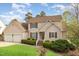 Charming home with a two-car garage, lush greenery, and a well-maintained lawn enhancing its curb appeal at 306 Neuse Ridge Dr, Clayton, NC 27527