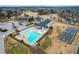 Aerial view of a community pool with lounge chairs and a slide, perfect for relaxation and fun at 306 Neuse Ridge Dr, Clayton, NC 27527