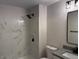 Stylish bathroom with white marble tile and modern lighting at 415 Sowell St, Durham, NC 27701