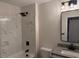 Modern bathroom featuring marble-like tiling, updated fixtures, and a sleek vanity at 415 Sowell St, Durham, NC 27701