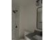 Bathroom with a shower featuring marble-like tile, a toilet, and a vanity with a black faucet at 415 Sowell St, Durham, NC 27701