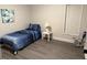 Bedroom featuring a single bed, side table and hardwood flooring at 415 Sowell St, Durham, NC 27701