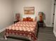 Comfortable bedroom with bed, lamps, and stylish bedding at 415 Sowell St, Durham, NC 27701