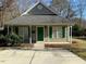 Charming craftsman style home with a green door and front porch at 415 Sowell St, Durham, NC 27701