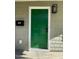 Green front door with black light fixture at 415 Sowell St, Durham, NC 27701
