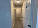 Hallway with white doors and gray wood floors at 415 Sowell St, Durham, NC 27701