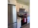 Well-lit kitchen featuring stainless steel appliances and white cabinets at 415 Sowell St, Durham, NC 27701