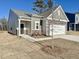 New construction home with attached garage and landscaping at 456 Glover Park Memorial Drive, Nashville, NC 27856